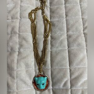 Tova 3 gold strand necklace with turquoise and orange.